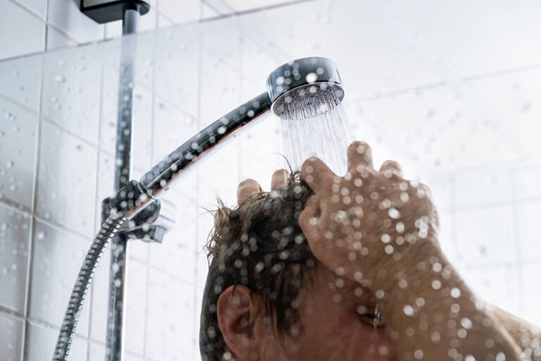 person washing hair in shower