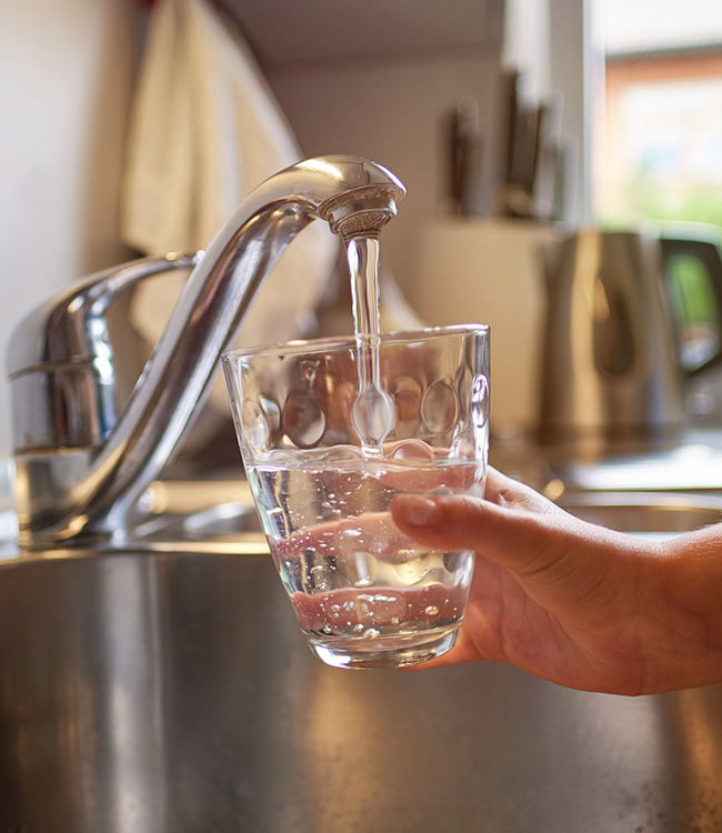 Filling water glass at sink