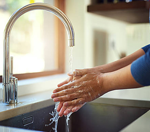 washing hands under running water